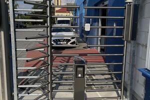 Entrance to the company premises through the external turnstile door