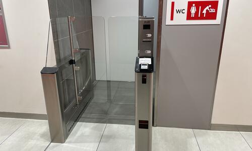 Entrance turnstiles with payment machine for toilets