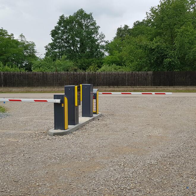 Barriers at the entrance to private land, parking lot and hotel