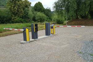 Barriers at the entrance to private land, parking lot and hotel